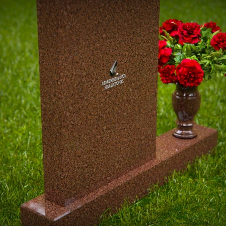 Beautiful upright headstones with flower vase details.