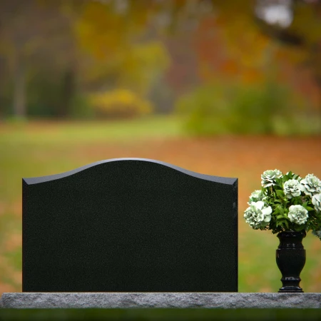 1257 - Graceful Granite Headstone with Curved Top and Floral Vase – Timeless Memorial Design