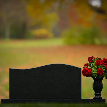 Modern headstones with subtle wave design and elegant floral accents.