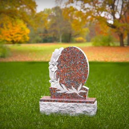 1550 - Oval Red Granite Headstone with Floral Engraving