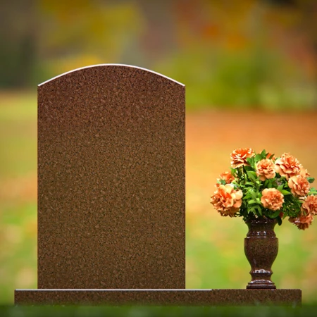 Beautiful upright headstones with flower vase details.