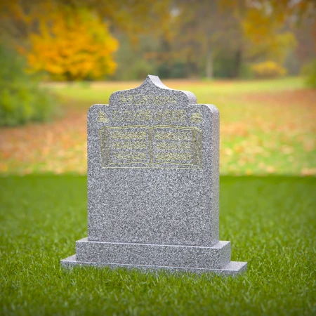 1414 - Islamic Headstone with Quran Engraving in a Peaceful Cemetery