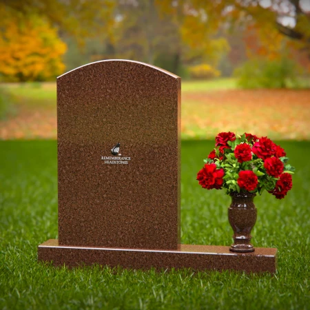 Beautiful upright headstones with flower vase details.