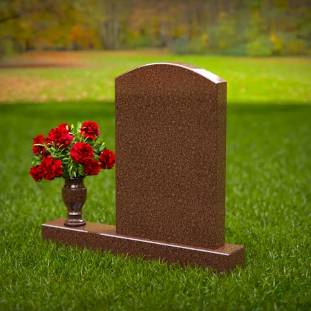 Beautiful upright headstones with flower vase details.